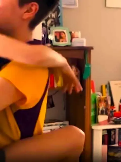 Woman jumps joyfully into the arms of a woman
