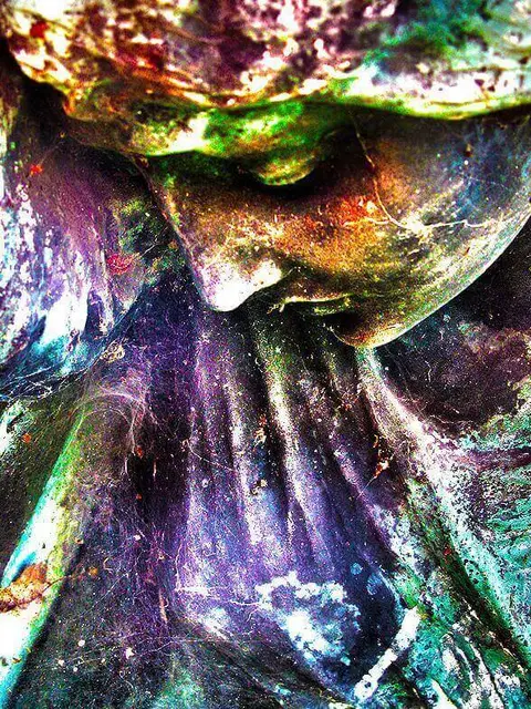 Sculpture of a woman looking down sadly
