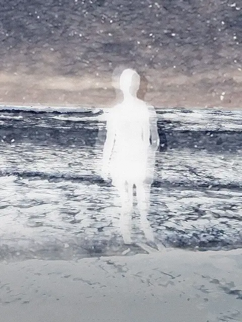 A woman walks on the beach