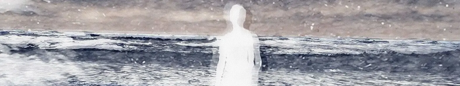 A woman walks on the beach