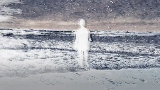 A woman walks on the beach