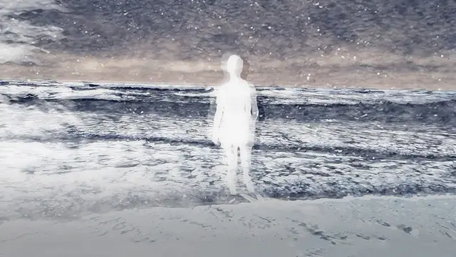 A woman walks on the beach