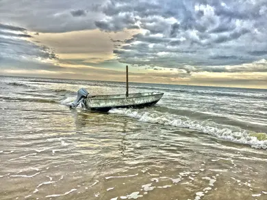 The lonely boat on the beach